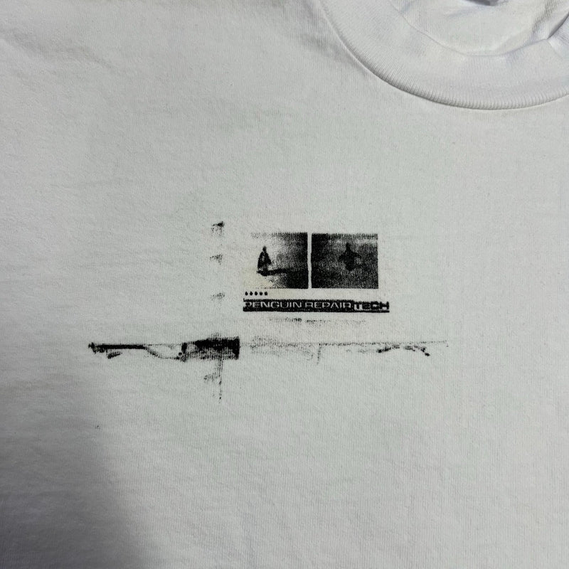 Five Star Silver white cotton t-shirt with distressed Penguin Repair Tech black graphic print on the chest.
