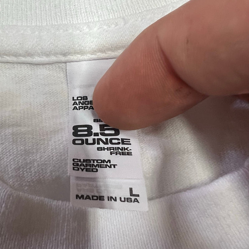 Five Star Silver white cotton graphic t-shirt tag showing 8.5 ounce shrink-free Los Angeles Apparel construction.